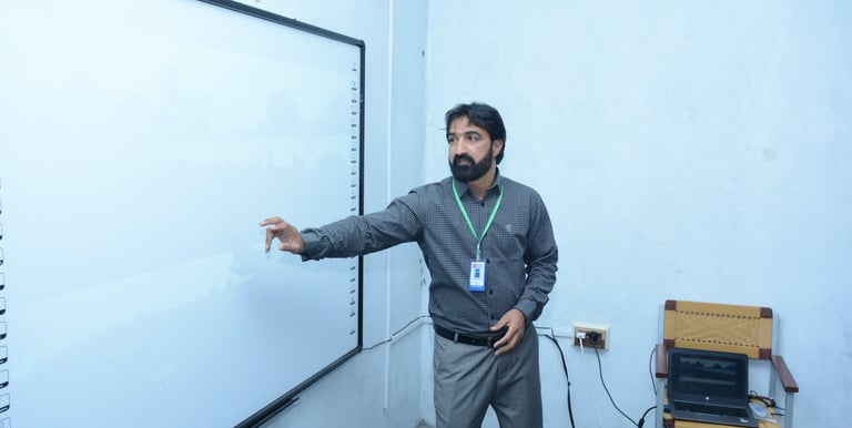 a man standing in front of a white board board