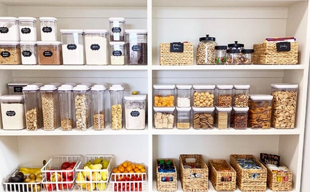 an organized pantry with a variety of bins and containers so everything is sorted
