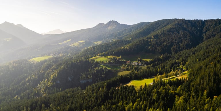 a mountain scene with a view of a valley