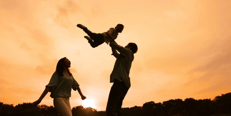 Parents playing with a child
