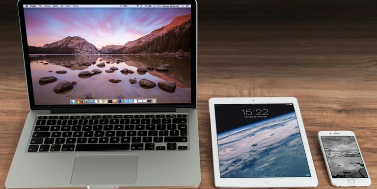 laptop tablet and phone on table