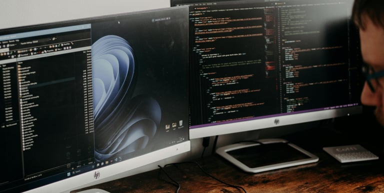 man working on screens