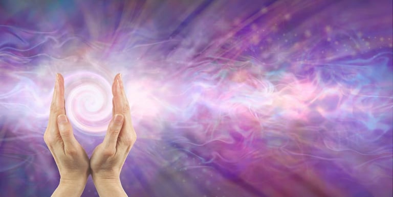 Hands channeling radiant energy with glowing swirl and purple aura — representing healing by Amber, Queen of Wands.