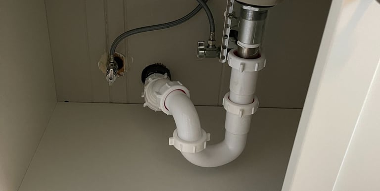 a sink with a sink and a toilet