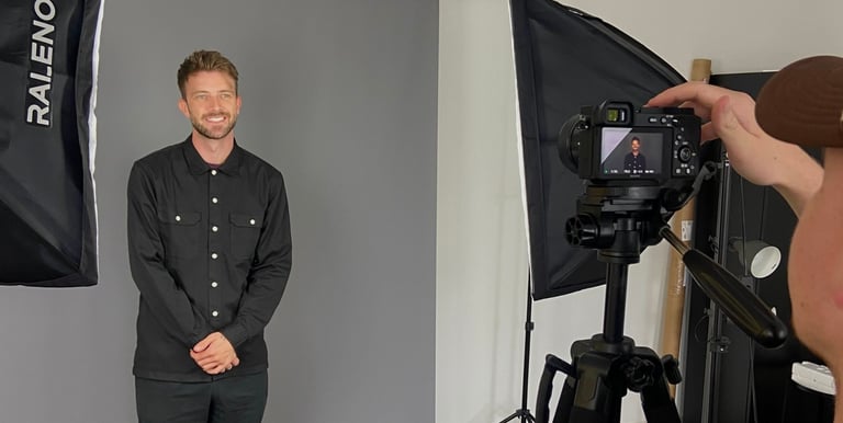 a man in a black shirt and a camera