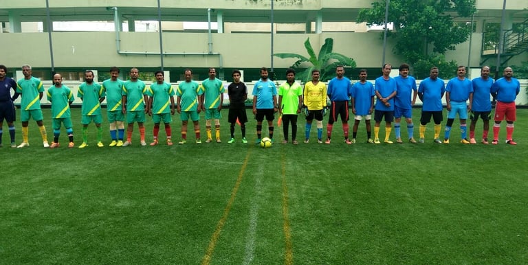 Football players enjoying a match on artificial turf
