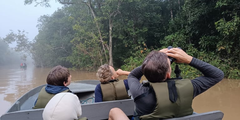 a group of people in a boat on a river