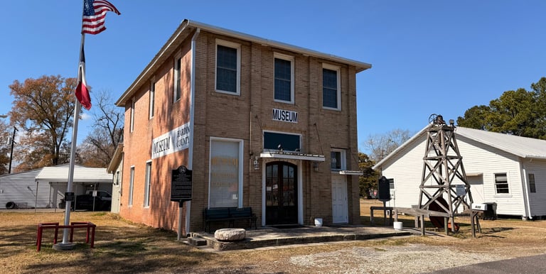 A brick building , museum of hardin county located in Kountze
