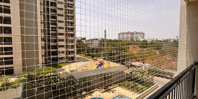 Residential balcony protected with pigeon net installation in Jogeshwari West Mumbai