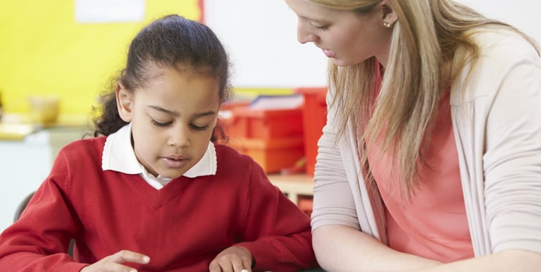 Specialist supporting child during educational assessment in Cheshire