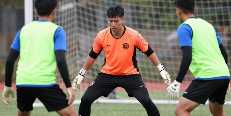 Close-up of a soccer training creator filming a drill with professional equipment.