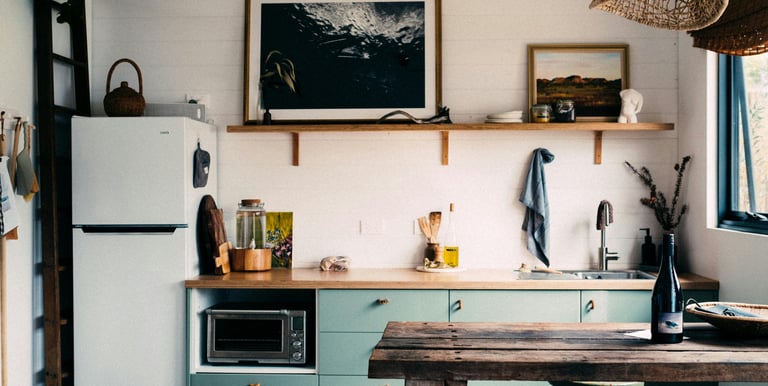 a kitchen with a table and stools