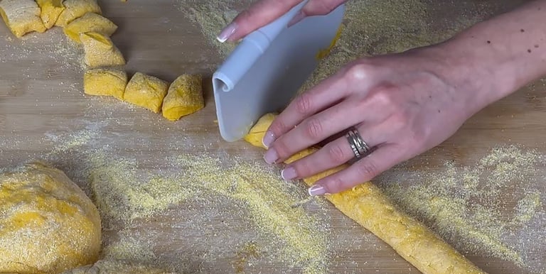 Cutting the rope into pieces to make gnocchi