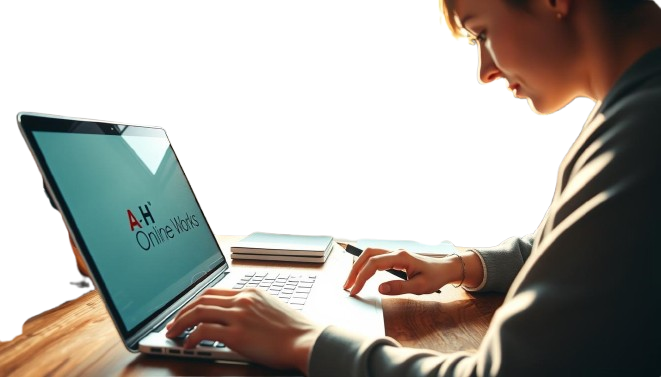 a man sitting at a desk with a laptop and a cell phone
