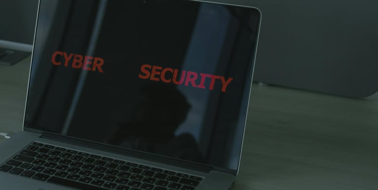 A laptop screen that reads Cyber Security
