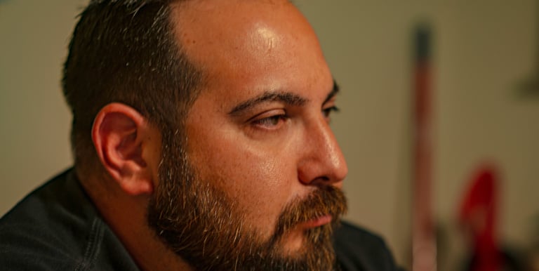 Side profile of a middle-aged man with a groomed brown beard and short dark hair. Athens, Oh
