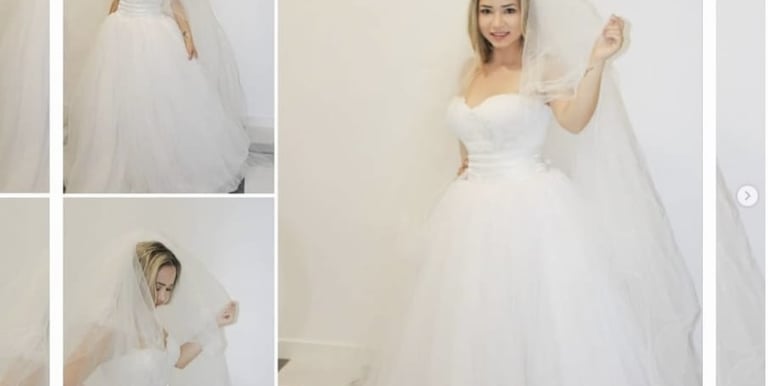 A happy bride with her dress