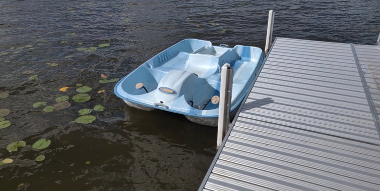 paddleboat at dock lakeside lake views southern michigan vrbo airbnb dock short term rental