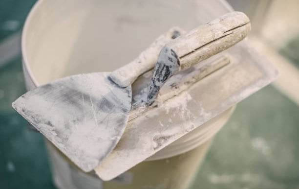 drywall tools on a bucket