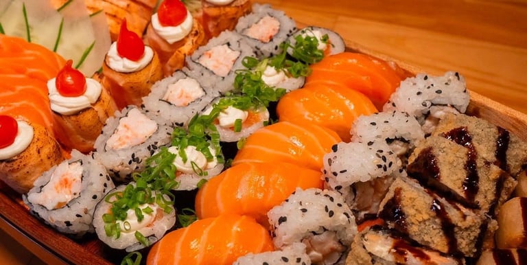 a long boat shaped plate with sushi and sushi