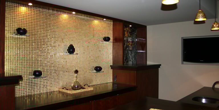 Gold tile back splash on a wet bar. 
