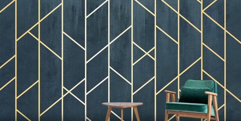 a chair and a chair in a room with a chair and a table and geometric wallpaper