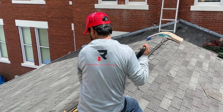 man working on roof to repair the roof