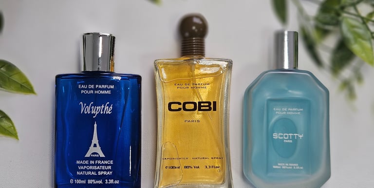 a variety of perfumes on a table