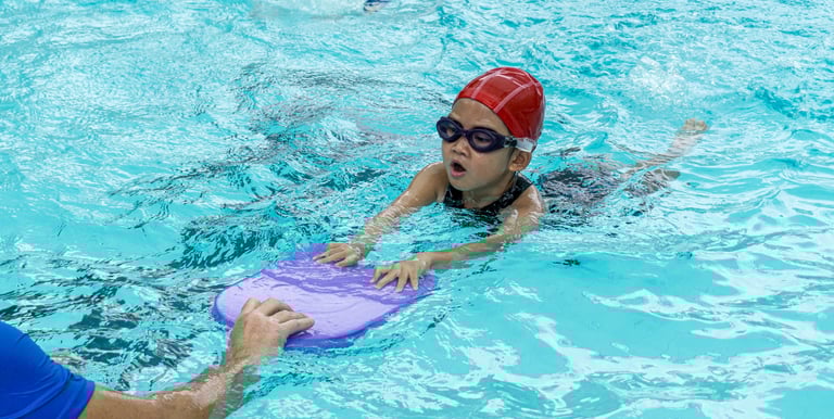 child learning to swim