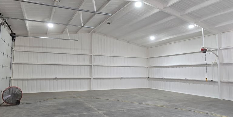open cell spray foam insulation inside a barn in lakewood, colorado