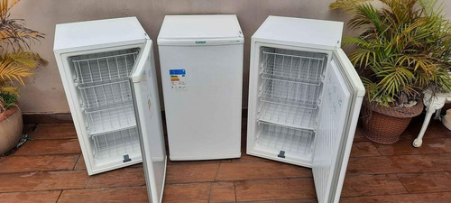 three refrigerators with a refrigerator and a planter