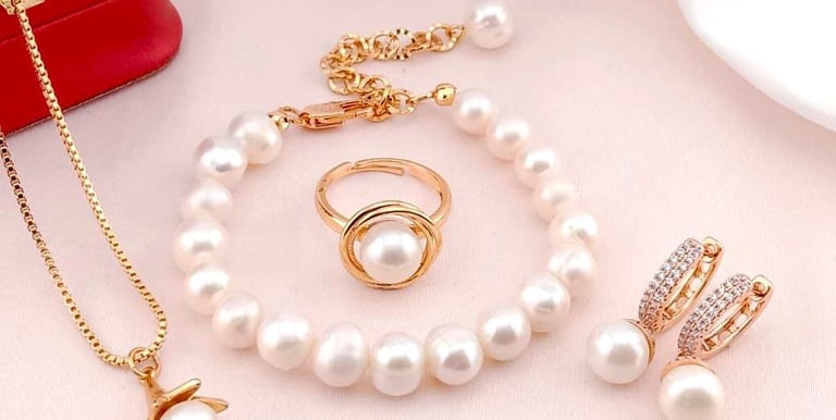a jewelry set with pearls and a necklace