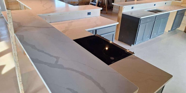 Stone countertops installed in open-concept kitchen and living area