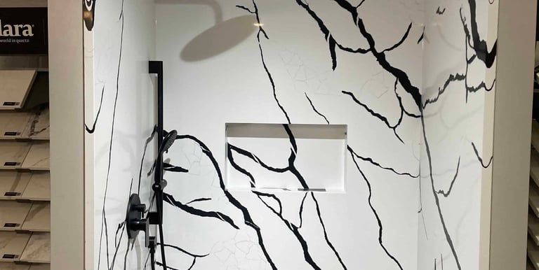 Polished stone shower surround with built-in shelving