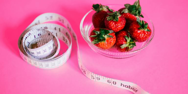 a bowl of strawberries and measuring tape measure tape measure tape measure tape measure tape