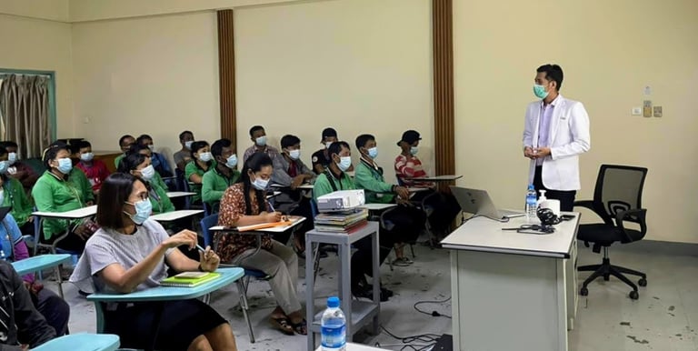Dr Zaw giving a health talk in a room