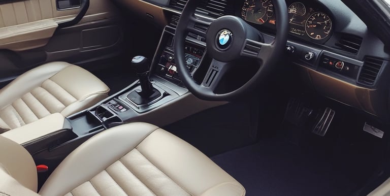 A collection of high-quality car accessories displayed on a wooden table.