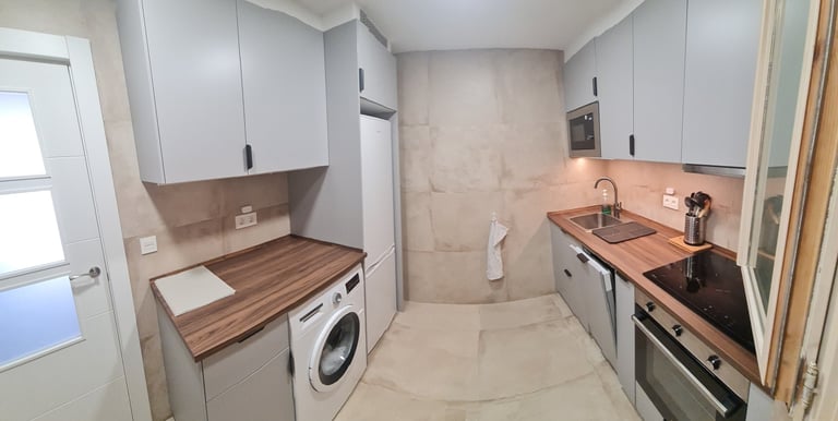 Fully equipped modern kitchen with updated appliances at Anne Apartment.