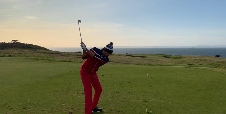 a man playing golf on a sunny day