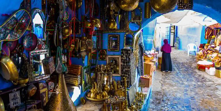 a woman in a blue room with a lot of gold