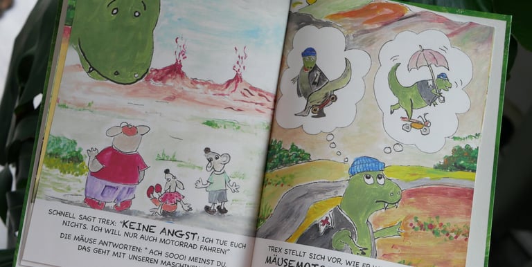 a person holding a book with a picture of a dinosaur