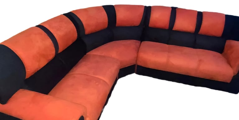 a couch with a black and orange couch and a black and white couch