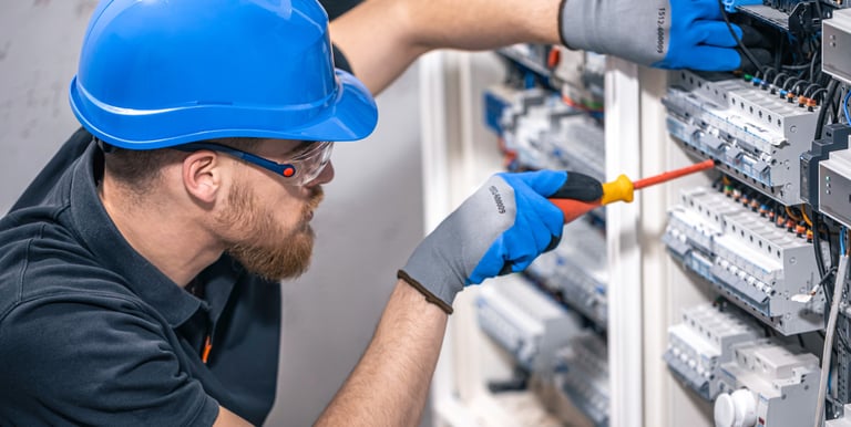 a man in a blue helmet, an electrician