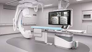 a hospital room with a large medical x-ray equipment