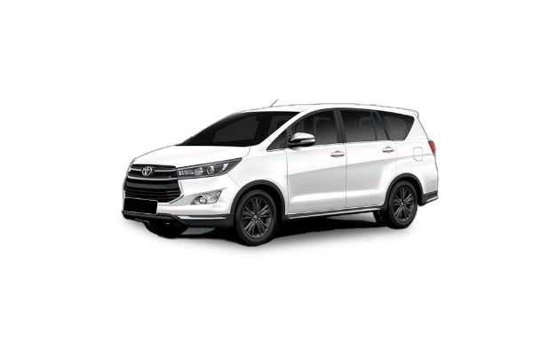 a white Toyota Innova car parked on a white background