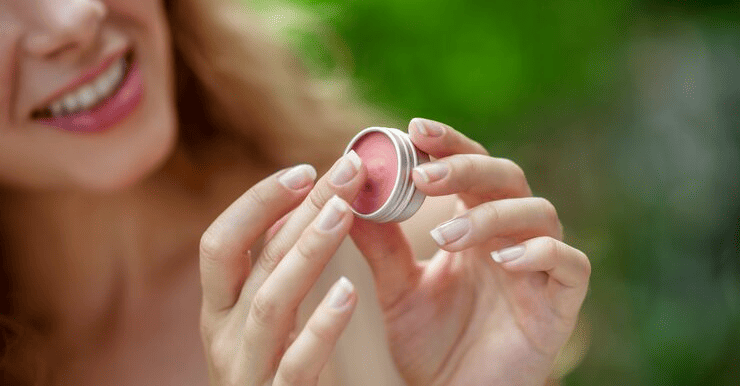 lip balm pretty young woman hold