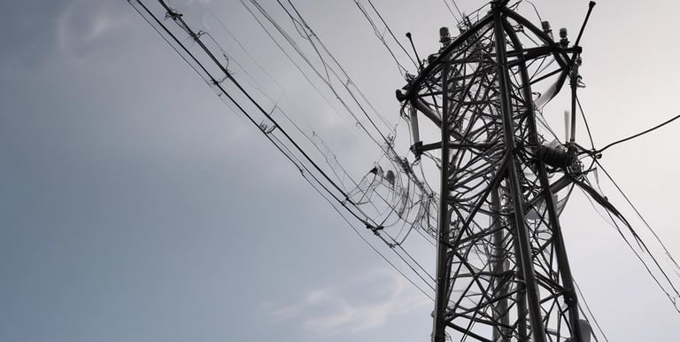 Close-up of a drone capturing detailed images of a bridge structure.