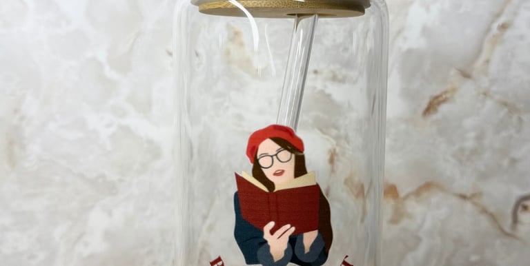 a glass jar with a straw and a straw in it for book lovers and readers 