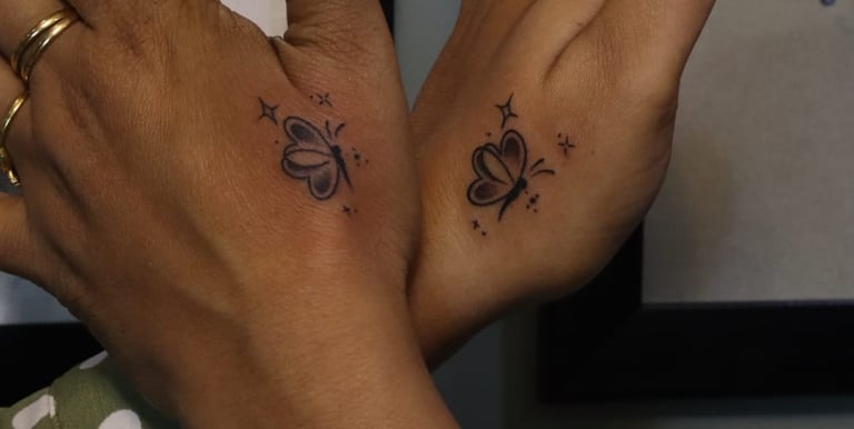 Fine line butterfly tattoo in minimal style by Dudo’s Tattoos Hyderabad