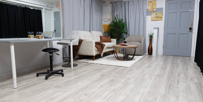 a living room with a couch and a chair